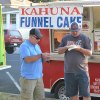 Local residents enjoy food truck food.